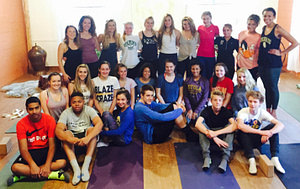 The yoga outreach Year of Service group poses for a photo after their yoga class on Community Day.