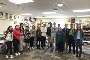 The childcare systems Year of Service group pose for a picture after one of their meetings.